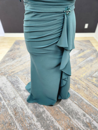Morilee MGNY 72827 off-the-shoulder scuba crepe mother of the bride gown with draped bodice, cascading ruffle slit, and fitted mermaid silhouette.