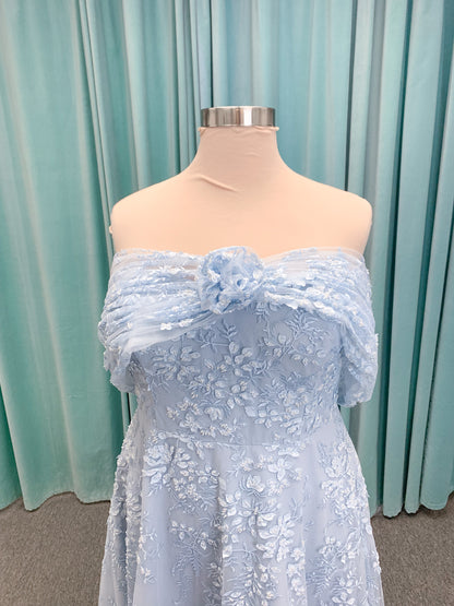 Morilee MLNY 73101 A-line mother of the bride dress on mannequin with strapless sweetheart neckline, detachable off-the-shoulder drape, 3D floral bodice, layered floral lace appliques, and full tulle skirt with pockets