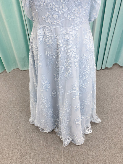 Morilee MLNY 73101 A-line mother of the bride dress on mannequin with strapless sweetheart neckline, detachable off-the-shoulder drape, 3D floral bodice, layered floral lace appliques, and full tulle skirt with pockets
