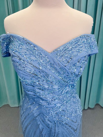 Morilee MLNY 73110 mermaid mother of the bride dress on mannequin with off-the-shoulder sweetheart neckline with foldover cuff, sequin-beaded net bodice, sheer tulle back panel, and sweep train