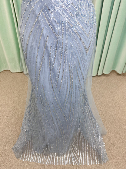 Morilee MLNY 73110 mermaid mother of the bride dress on mannequin with off-the-shoulder sweetheart neckline with foldover cuff, sequin-beaded net bodice, sheer tulle back panel, and sweep train