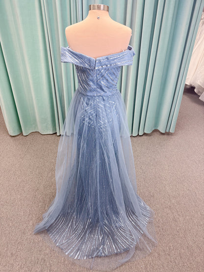 Morilee MLNY 73110 mermaid mother of the bride dress on mannequin with off-the-shoulder sweetheart neckline with foldover cuff, sequin-beaded net bodice, sheer tulle back panel, and sweep train