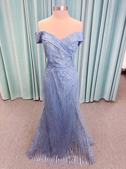 Morilee MLNY 73110 mermaid mother of the bride dress on mannequin with off-the-shoulder sweetheart neckline with foldover cuff, sequin-beaded net bodice, sheer tulle back panel, and sweep train