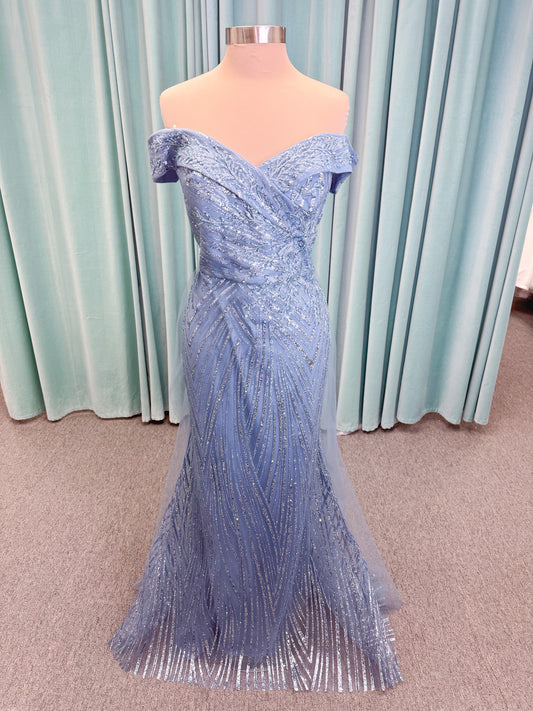 Morilee MLNY 73110 mermaid mother of the bride dress on mannequin with off-the-shoulder sweetheart neckline with foldover cuff, sequin-beaded net bodice, sheer tulle back panel, and sweep train