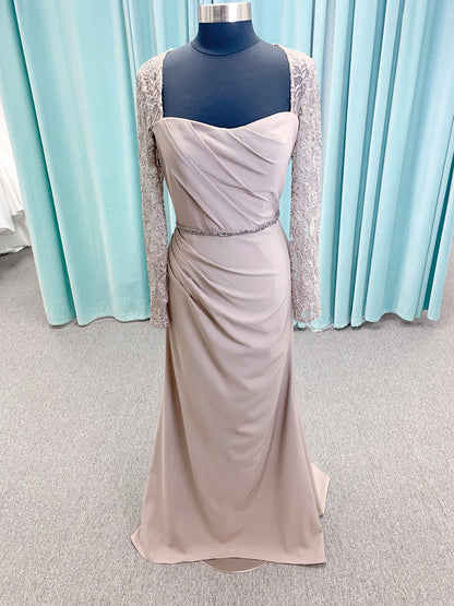 Morilee MLNY 73160 sheath mother of the bride dress on mannequin with modified sweetheart neckline, draped crepe bodice, sheer illusion long sleeves with lace applique, detachable beaded belt, and keyhole back