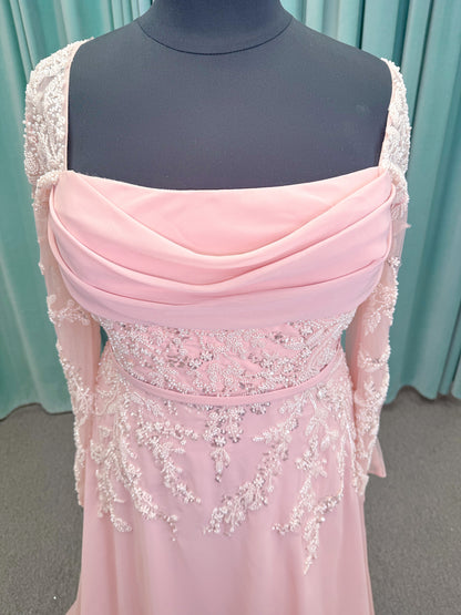 Morilee MLNY 73185 plus size A-line mother of the bride dress on mannequin with square neckline, draped chiffon bodice, sheer illusion long sleeves, beaded appliques, detachable self-belt, and flowing A-line skirt