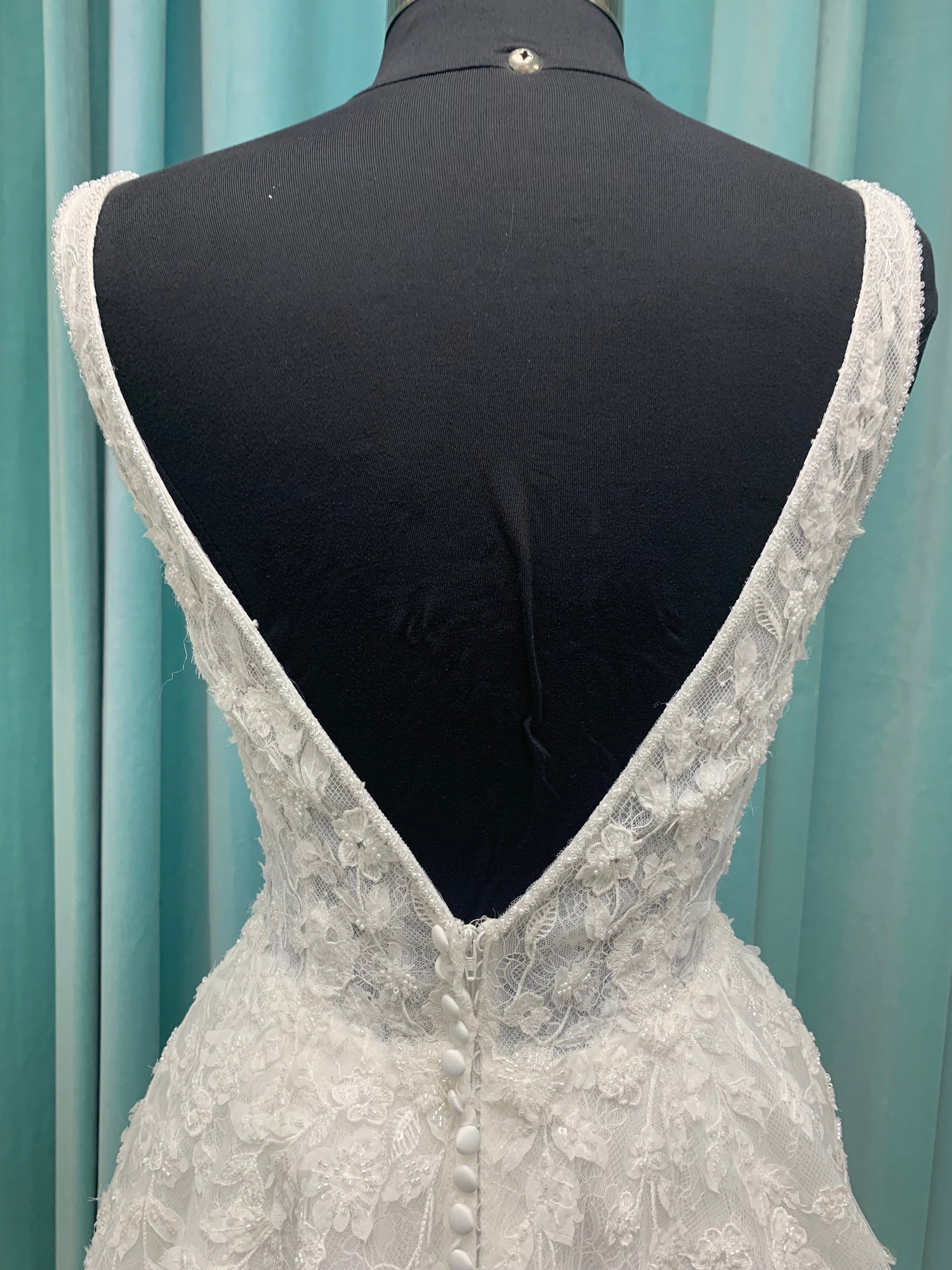 Morilee Style 2736 botanical A-line wedding dress with plunging v-neckline, beaded trim, 3D embroidered lace over Chantilly lace, and open v-back