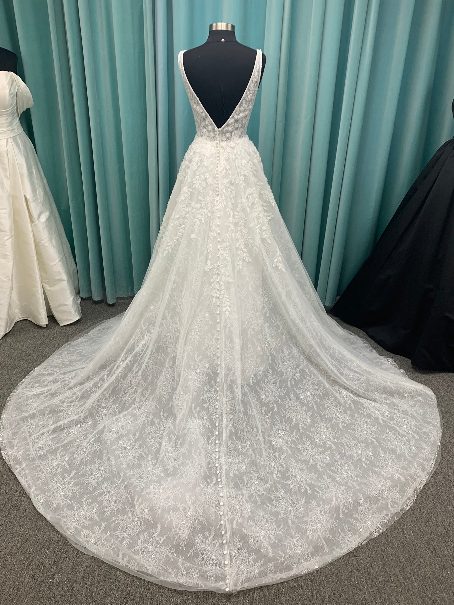 Morilee Style 2736 botanical A-line wedding dress with plunging v-neckline, beaded trim, 3D embroidered lace over Chantilly lace, and open v-back