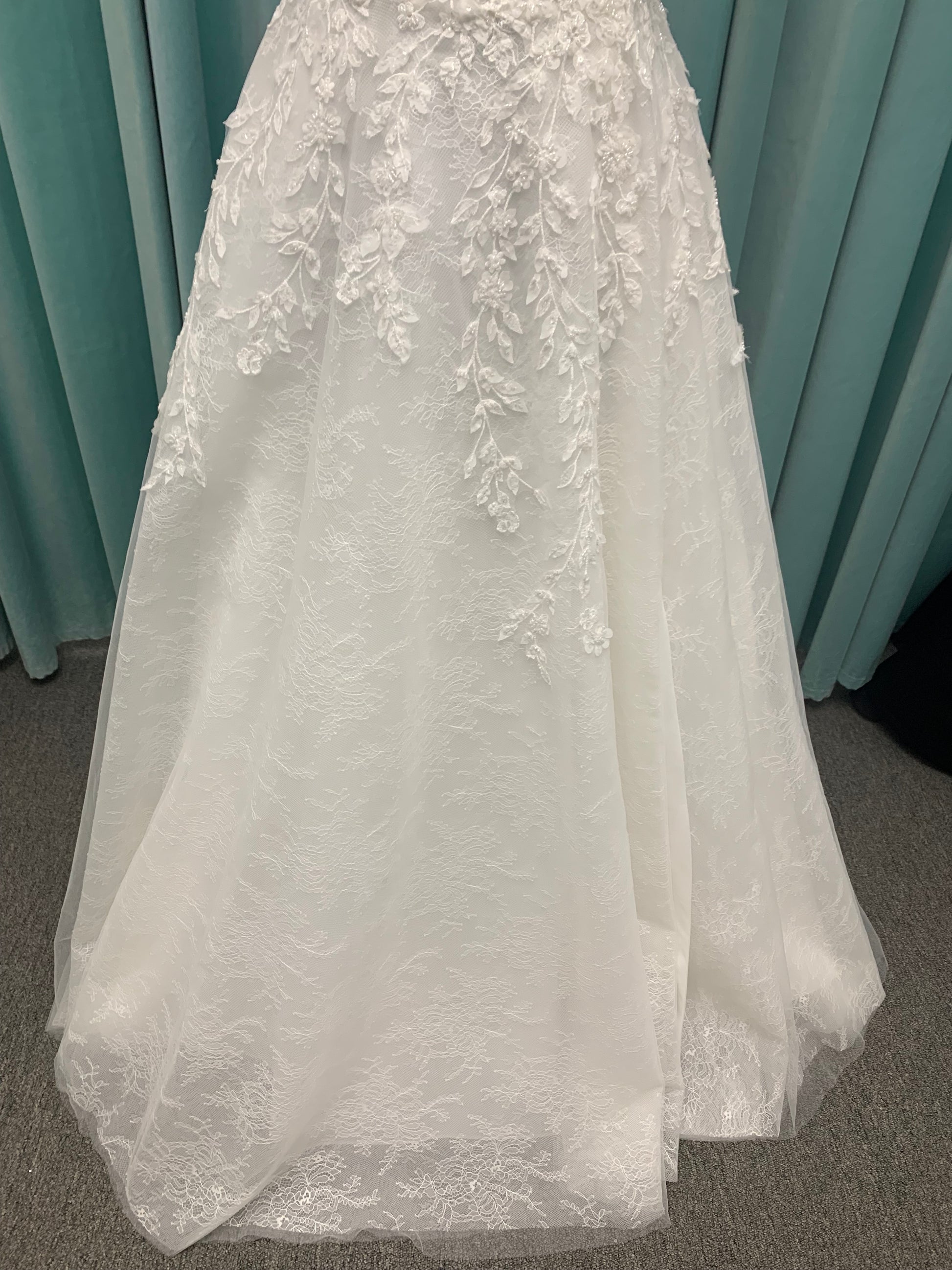 Morilee Style 2736 botanical A-line wedding dress with plunging v-neckline, beaded trim, 3D embroidered lace over Chantilly lace, and open v-back