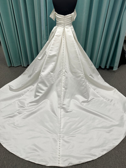 Off-the-shoulder satin A-line wedding dress with detachable straps, leg slit, pockets, and embroidered floral detailing by Essense of Australia style D4187