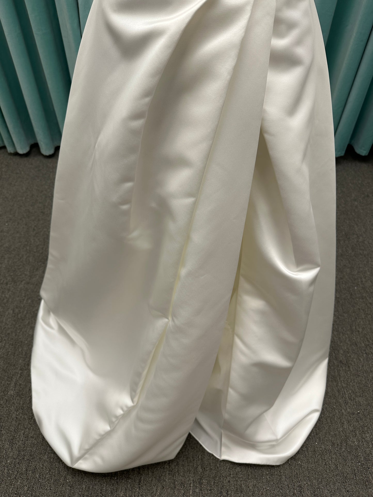 Off-the-shoulder satin A-line wedding dress with detachable straps, leg slit, pockets, and embroidered floral detailing by Essense of Australia style D4187