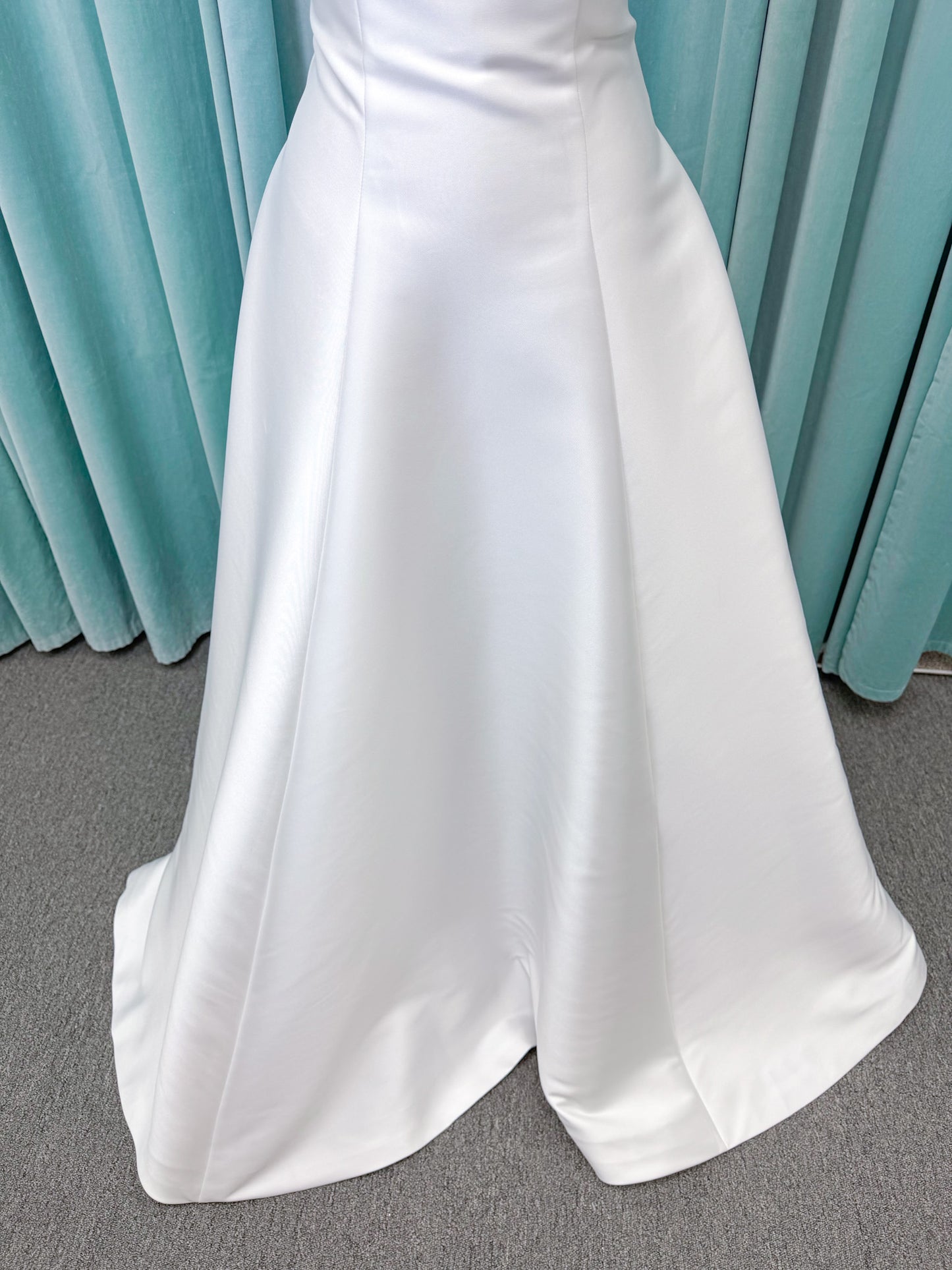 Strapless A-line wedding dress with a scoop neckline, structured drop-waist bodice, clean princess seams, and smooth full skirt.