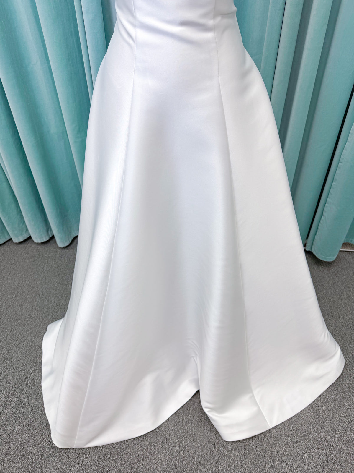 Strapless A-line wedding dress with a scoop neckline, structured drop-waist bodice, clean princess seams, and smooth full skirt.