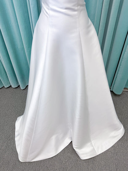 Strapless A-line wedding dress with a scoop neckline, structured drop-waist bodice, clean princess seams, and smooth full skirt.