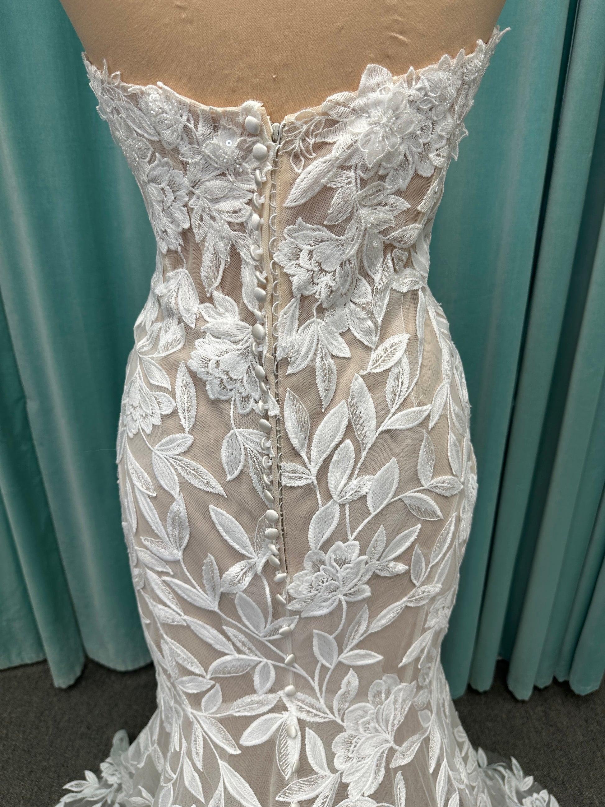 Morilee Santana wedding dress style 2739 featuring strapless sweetheart neckline, floral beaded lace, detachable long sleeves with bow streamers, and fit and flare silhouette