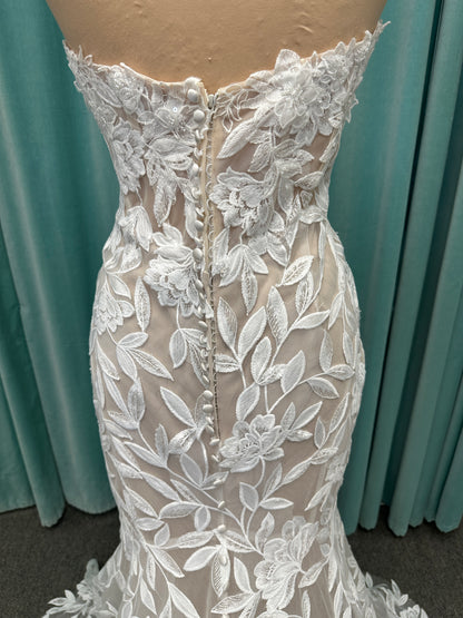 Morilee Santana wedding dress style 2739 featuring strapless sweetheart neckline, floral beaded lace, detachable long sleeves with bow streamers, and fit and flare silhouette
