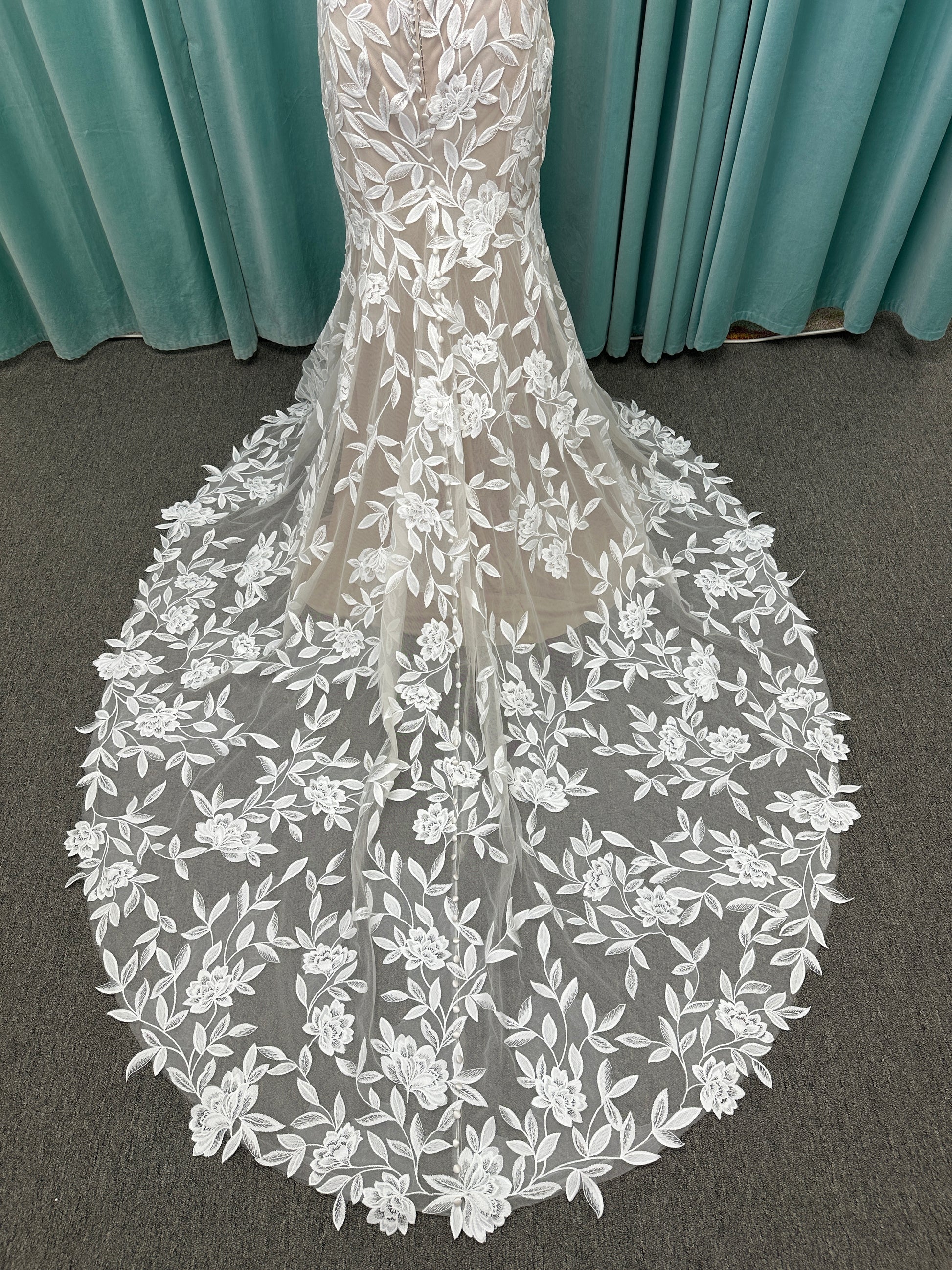 Morilee Santana wedding dress style 2739 featuring strapless sweetheart neckline, floral beaded lace, detachable long sleeves with bow streamers, and fit and flare silhouette