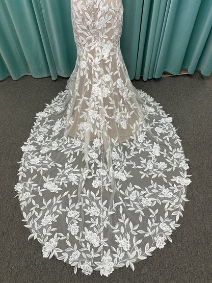 Morilee Santana wedding dress style 2739 featuring strapless sweetheart neckline, floral beaded lace, detachable long sleeves with bow streamers, and fit and flare silhouette