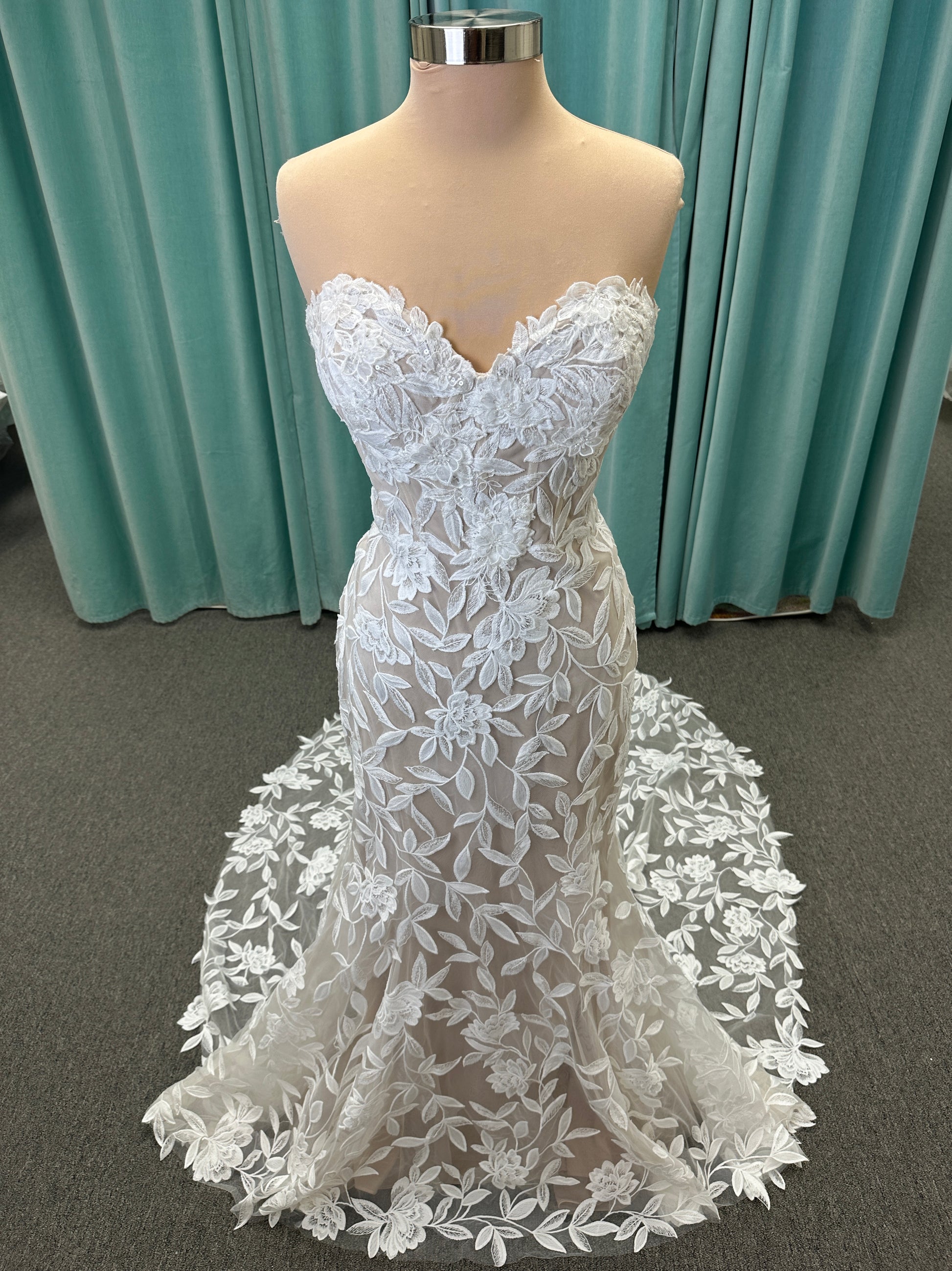 Morilee Santana wedding dress style 2739 featuring strapless sweetheart neckline, floral beaded lace, detachable long sleeves with bow streamers, and fit and flare silhouette