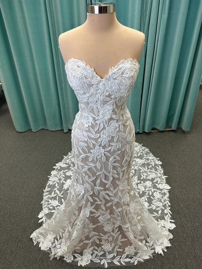 Morilee Santana wedding dress style 2739 featuring strapless sweetheart neckline, floral beaded lace, detachable long sleeves with bow streamers, and fit and flare silhouette