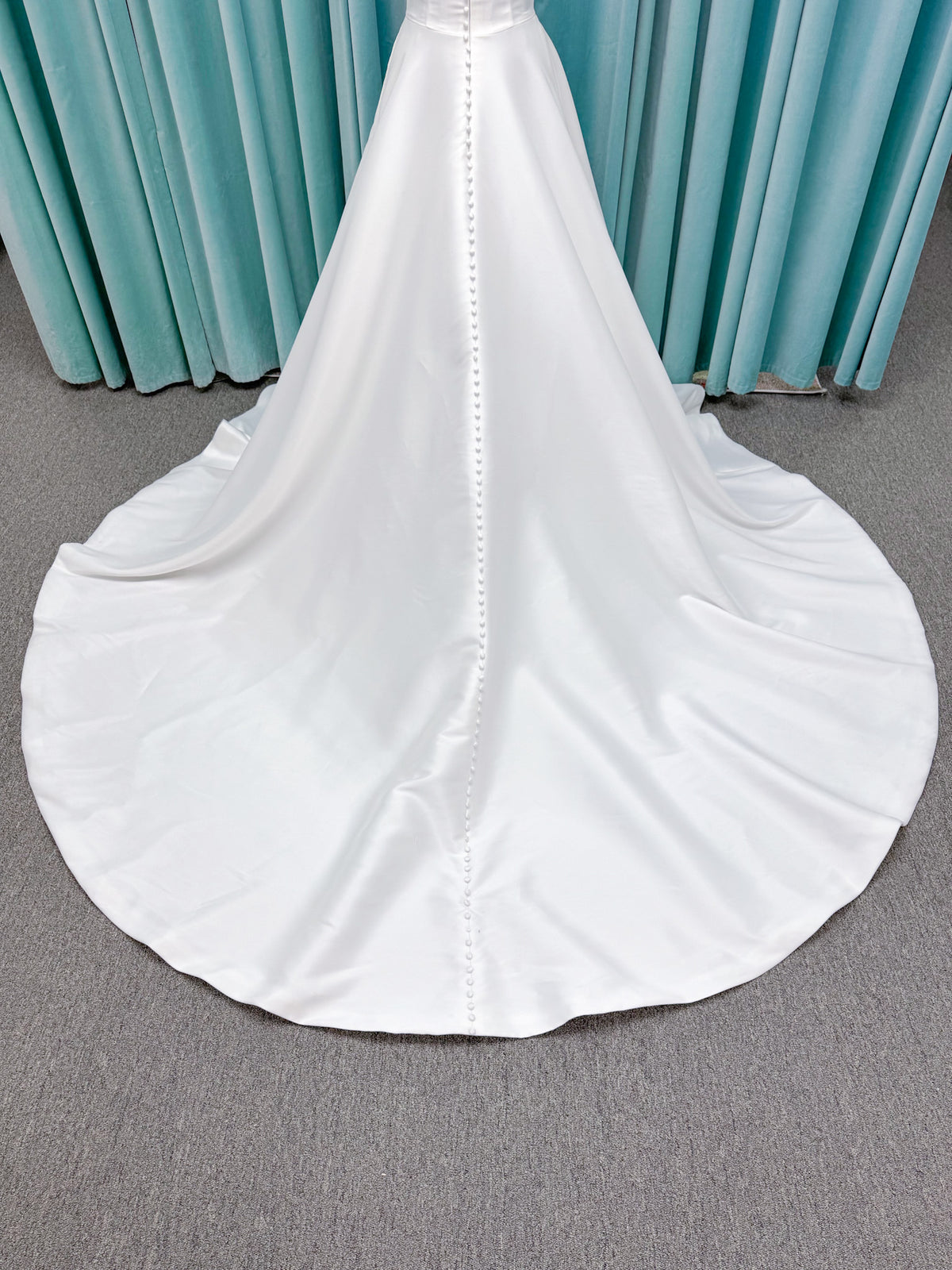 Light Mikado A-line wedding dress with strapless bodice, plunging V-neckline, illusion inset, defined waist, and full skirt.