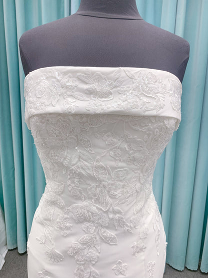 Morilee 2905 Atalanta fit and flare wedding dress in stretch Mikado with fold-over strapless neck, beaded lace bodice, and detachable double-loop embellished bow.