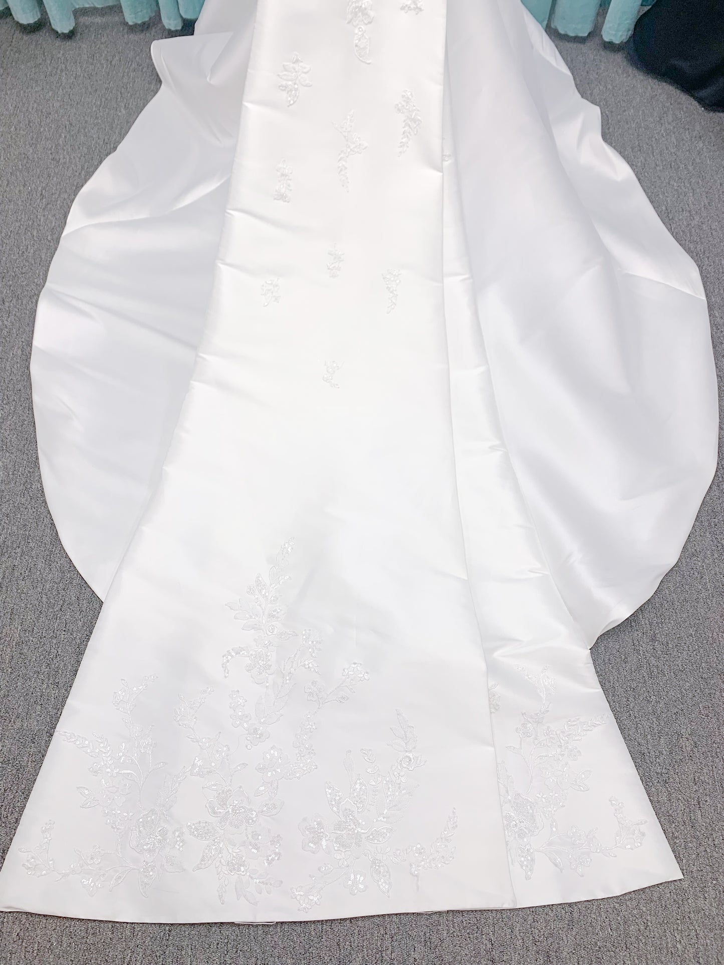 Morilee 2905 Atalanta fit and flare wedding dress in stretch Mikado with fold-over strapless neck, beaded lace bodice, and detachable double-loop embellished bow.
