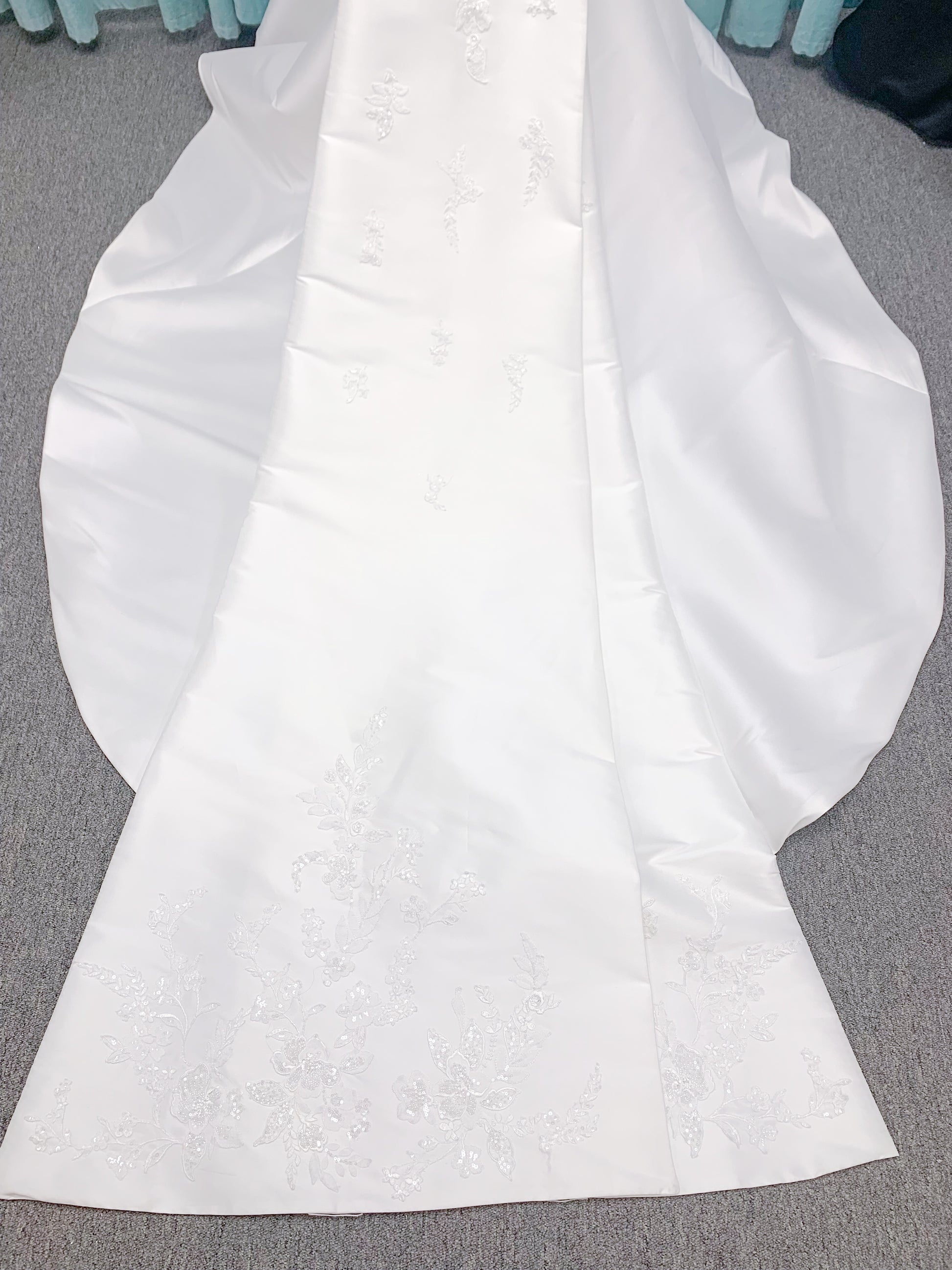 Morilee 2905 Atalanta fit and flare wedding dress in stretch Mikado with fold-over strapless neck, beaded lace bodice, and detachable double-loop embellished bow.