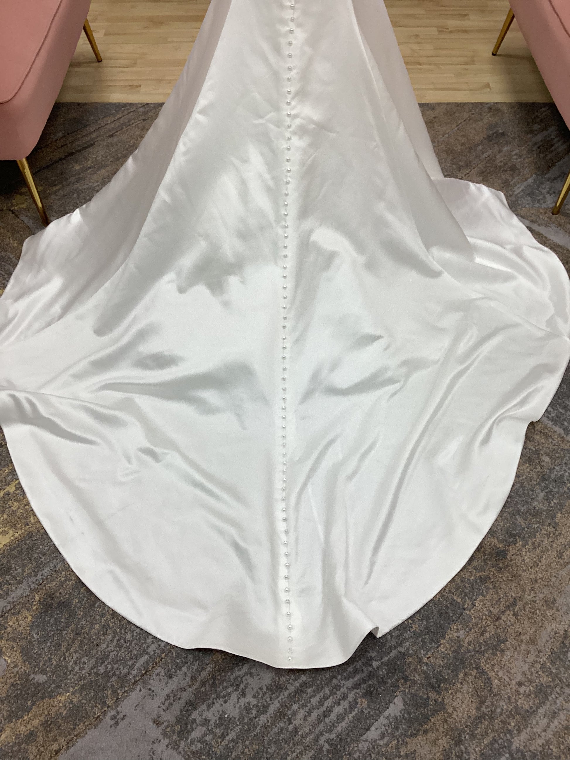  Morilee Atete wedding dress style 2921, a satin fit and flare bridal gown with a strapless scoop neckline and detachable pearl drape.