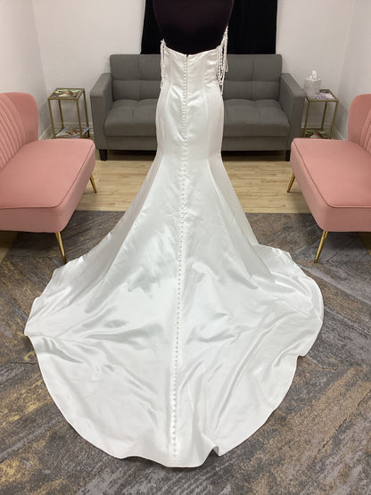  Morilee Atete wedding dress style 2921, a satin fit and flare bridal gown with a strapless scoop neckline and detachable pearl drape.
