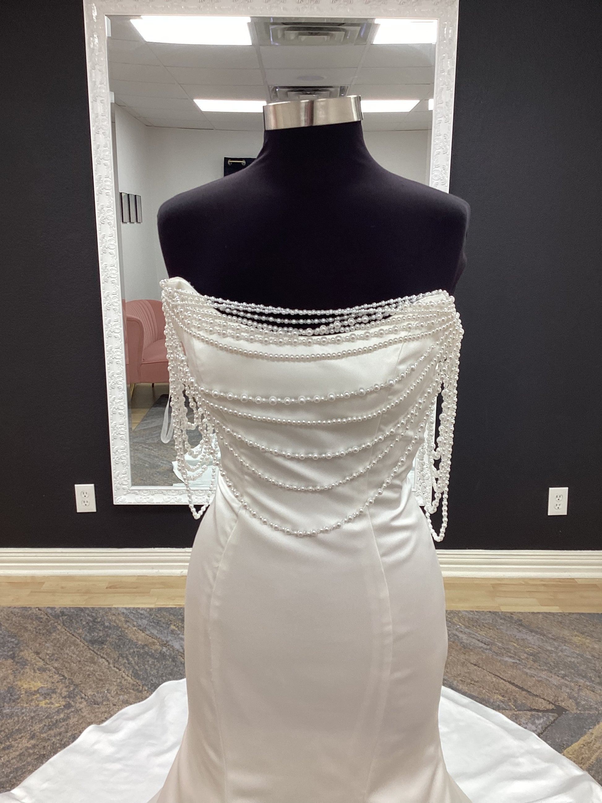  Morilee Atete wedding dress style 2921, a satin fit and flare bridal gown with a strapless scoop neckline and detachable pearl drape.