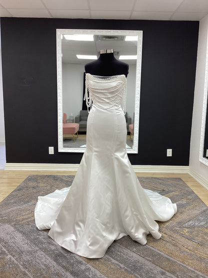  Morilee Atete wedding dress style 2921, a satin fit and flare bridal gown with a strapless scoop neckline and detachable pearl drape.