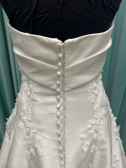 Essense of Australia D4195 ivory lace and Mikado drop-waist wedding dress on mannequin with strapless square neckline, 3D appliqué bodice, and A-line skirt.
