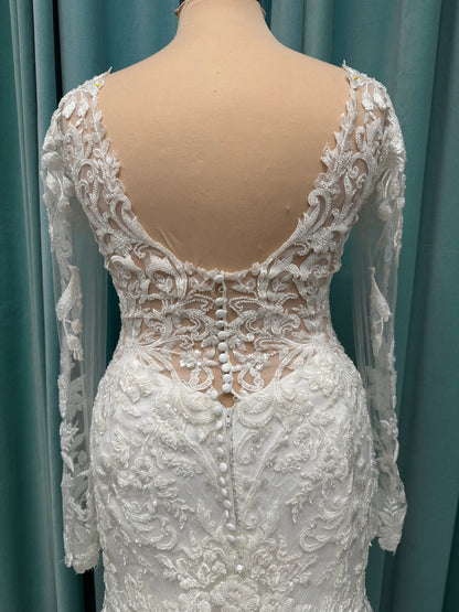 Essense of Australia D4213 lace fit-and-flare wedding dress with plunging neckline and sheer lace sleeves featuring a long lace train