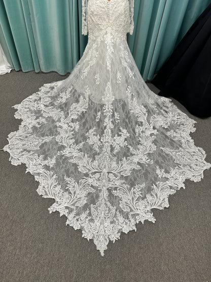 Essense of Australia D4213 lace fit-and-flare wedding dress with plunging neckline and sheer lace sleeves featuring a long lace train