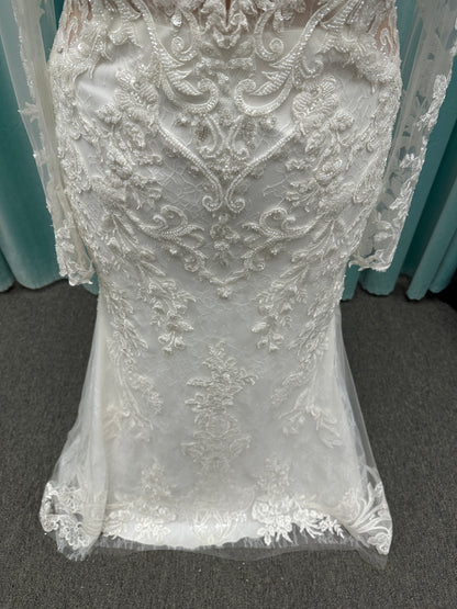 Essense of Australia D4213 lace fit-and-flare wedding dress with plunging neckline and sheer lace sleeves featuring a long lace train