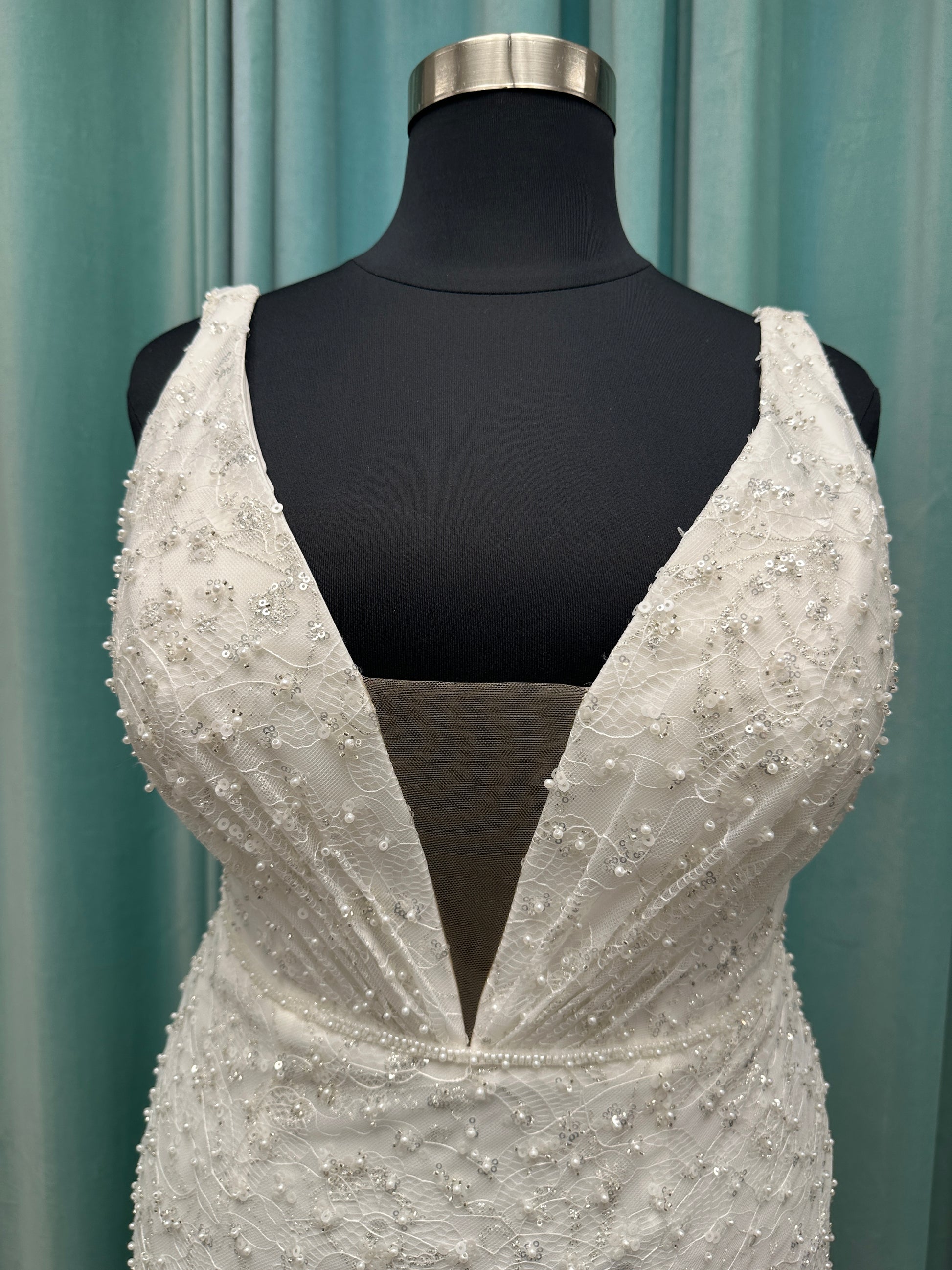 Plus size beaded lace column wedding dress with plunging V neckline, illusion tulle inset, and low V back by Stella York Style 8006