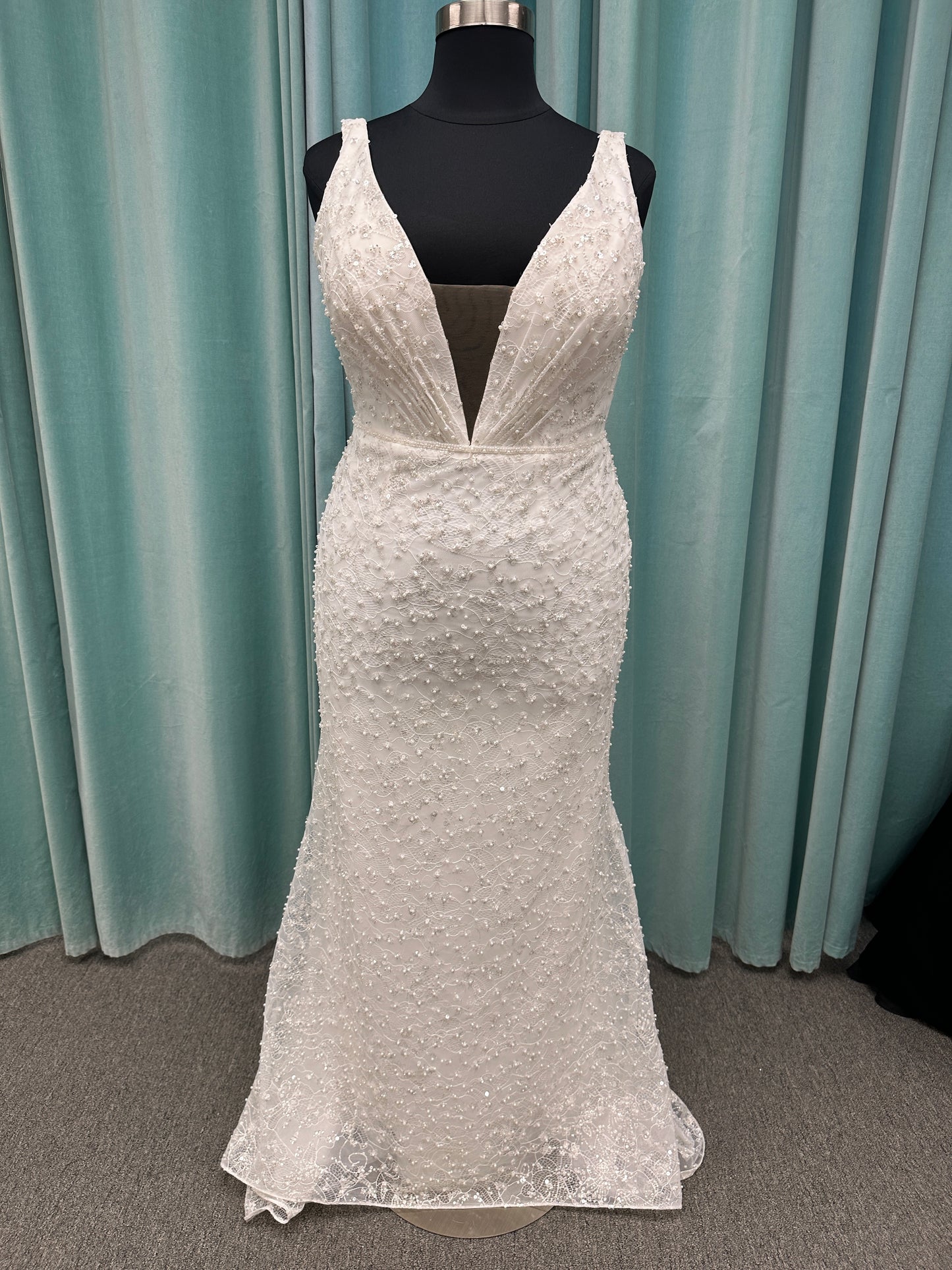 Plus size beaded lace column wedding dress with plunging V neckline, illusion tulle inset, and low V back by Stella York Style 8006