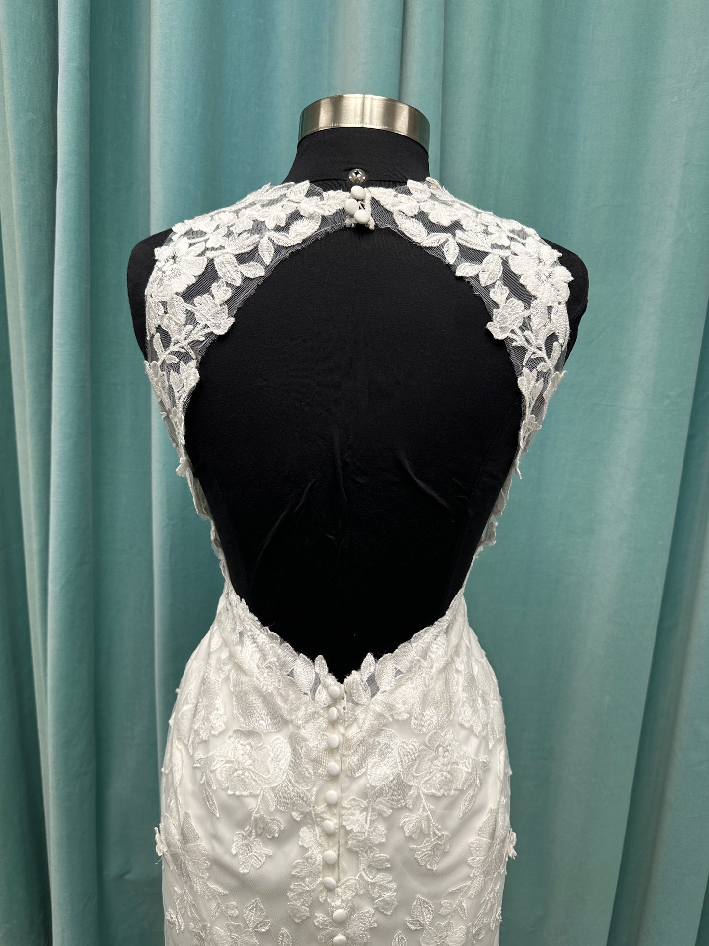 Essense of Australia D4141 lace fit-and-flare wedding dress with high illusion neckline, sheer bodice, low keyhole back, and shaped lace train