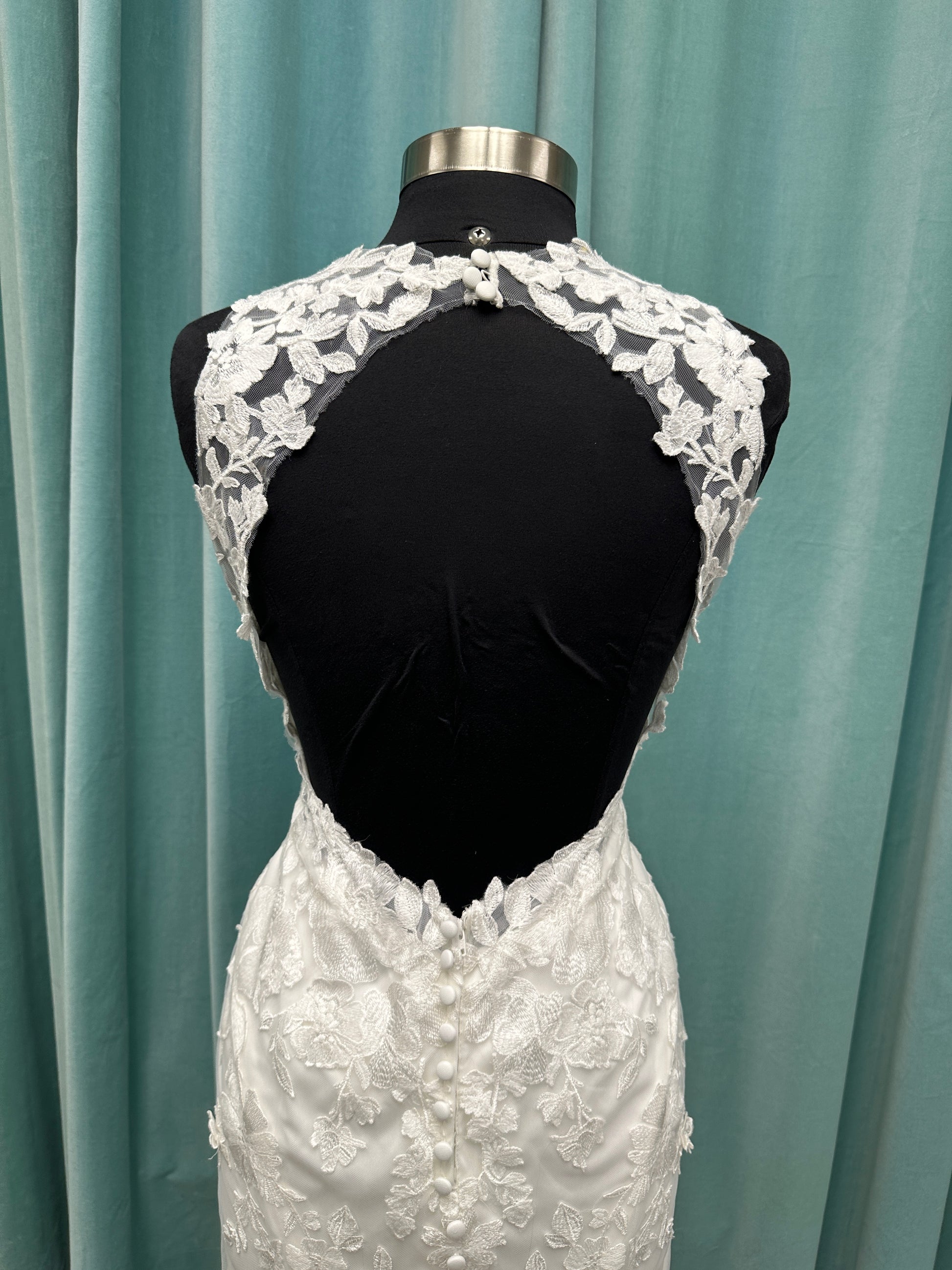 Essense of Australia D4141 lace fit-and-flare wedding dress with high illusion neckline, sheer bodice, low keyhole back, and shaped lace train
