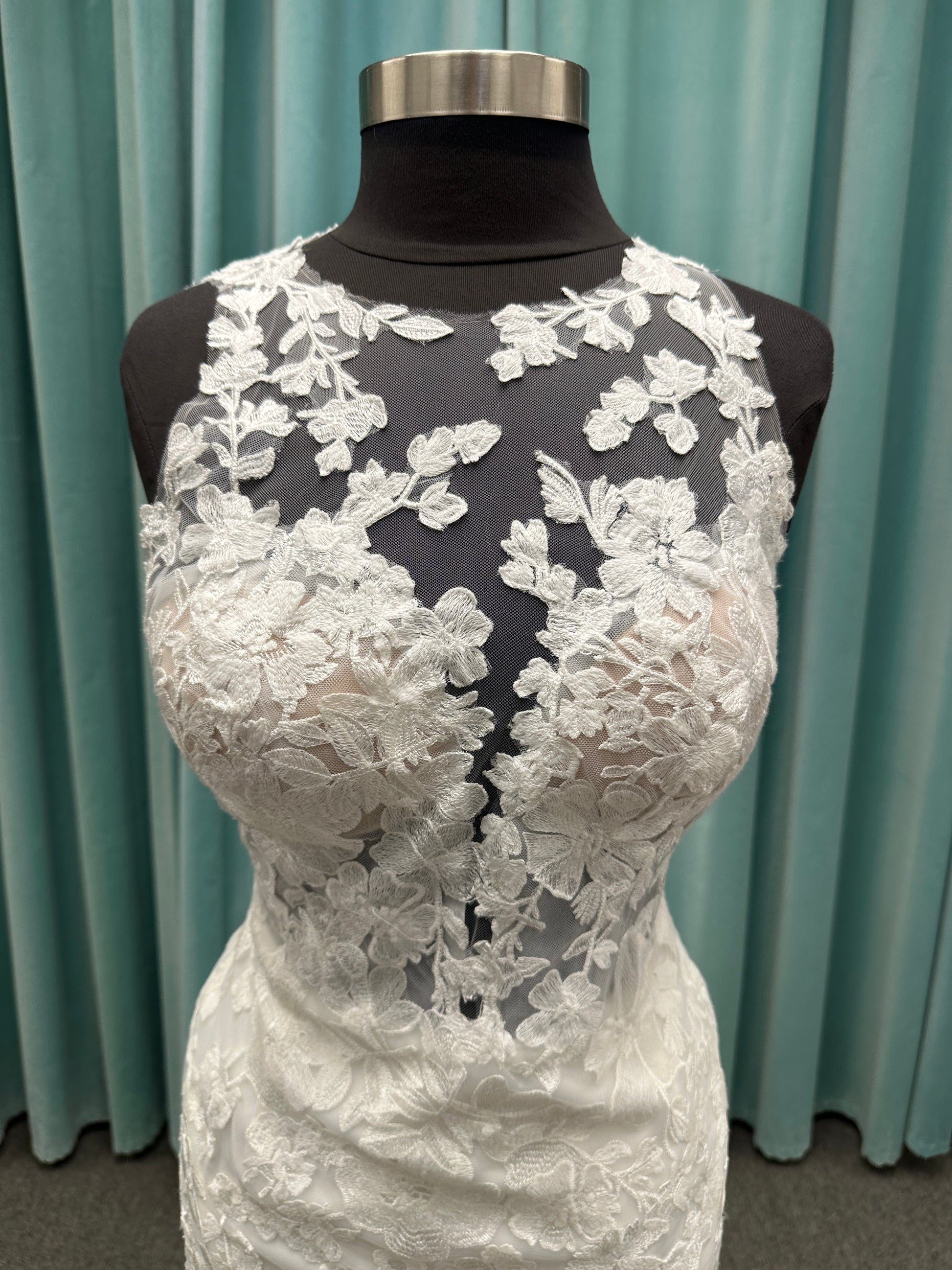 Essense of Australia D4141 lace fit-and-flare wedding dress with high illusion neckline, sheer bodice, low keyhole back, and shaped lace train