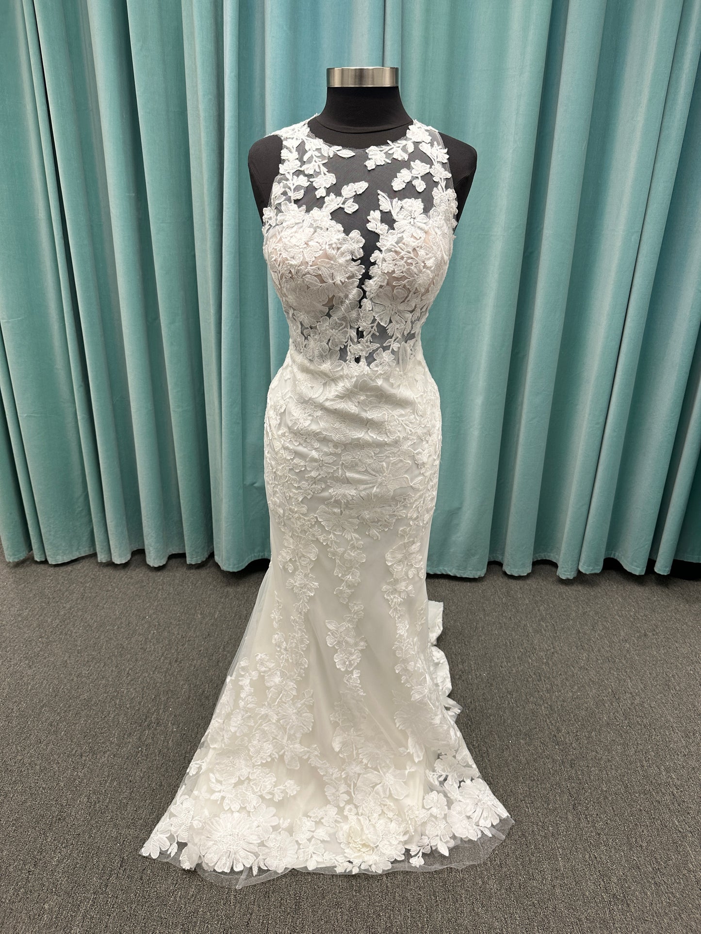 Essense of Australia D4141 lace fit-and-flare wedding dress with high illusion neckline, sheer bodice, low keyhole back, and shaped lace train