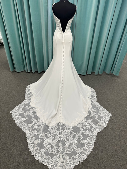 Essense of Australia D4181 column wedding dress with plunging V-neckline, pearl straps, lace bodice, and sleek crepe skirt with lace train