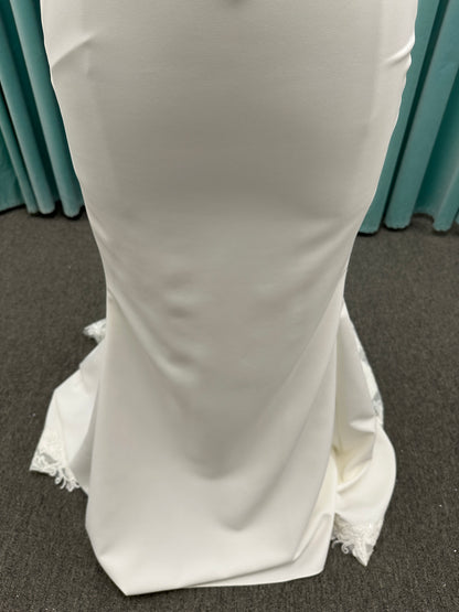 Essense of Australia D4181 column wedding dress with plunging V-neckline, pearl straps, lace bodice, and sleek crepe skirt with lace train