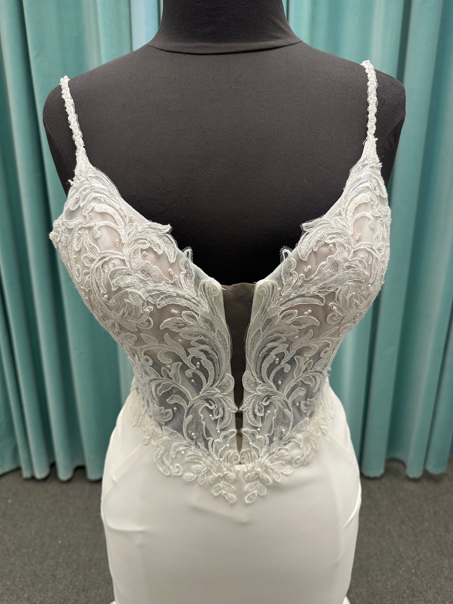 Essense of Australia D4181 column wedding dress with plunging V-neckline, pearl straps, lace bodice, and sleek crepe skirt with lace train
