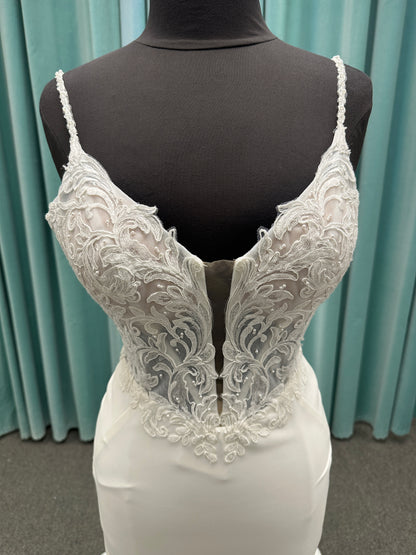 Essense of Australia D4181 column wedding dress with plunging V-neckline, pearl straps, lace bodice, and sleek crepe skirt with lace train