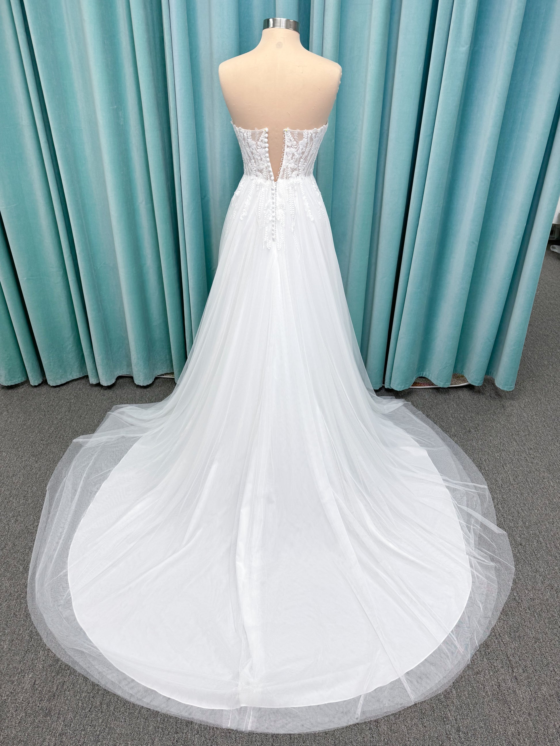 Carolyn A-line Wedding Dress in Ivory, Size 8 — strapless bodice, lace appliqués, beaded details, tulle skirt
