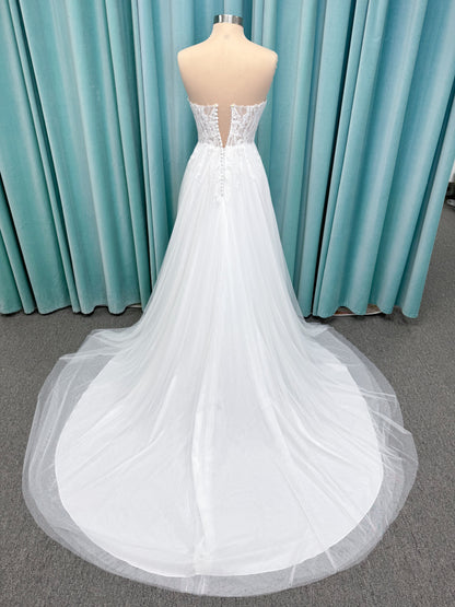 Carolyn A-line Wedding Dress in Ivory, Size 8 — strapless bodice, lace appliqués, beaded details, tulle skirt