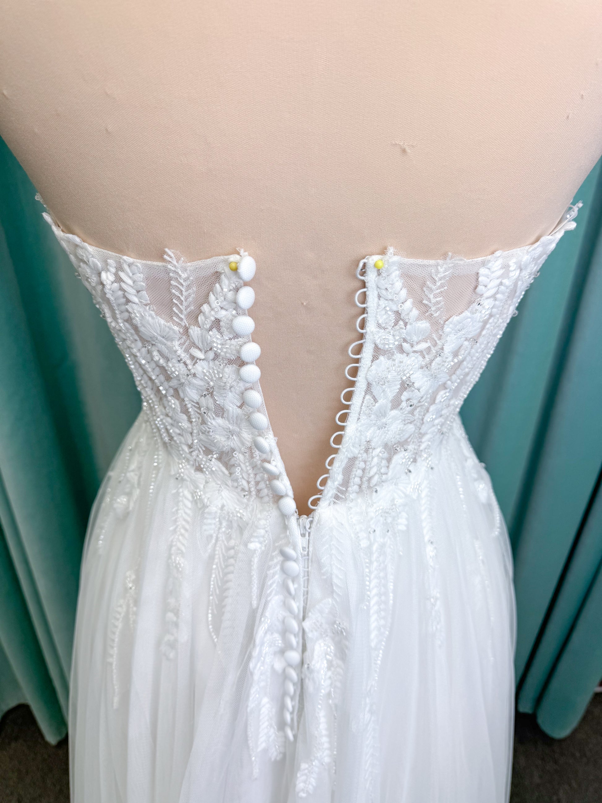 Carolyn A-line Wedding Dress in Ivory, Size 8 — strapless bodice, lace appliqués, beaded details, tulle skirt