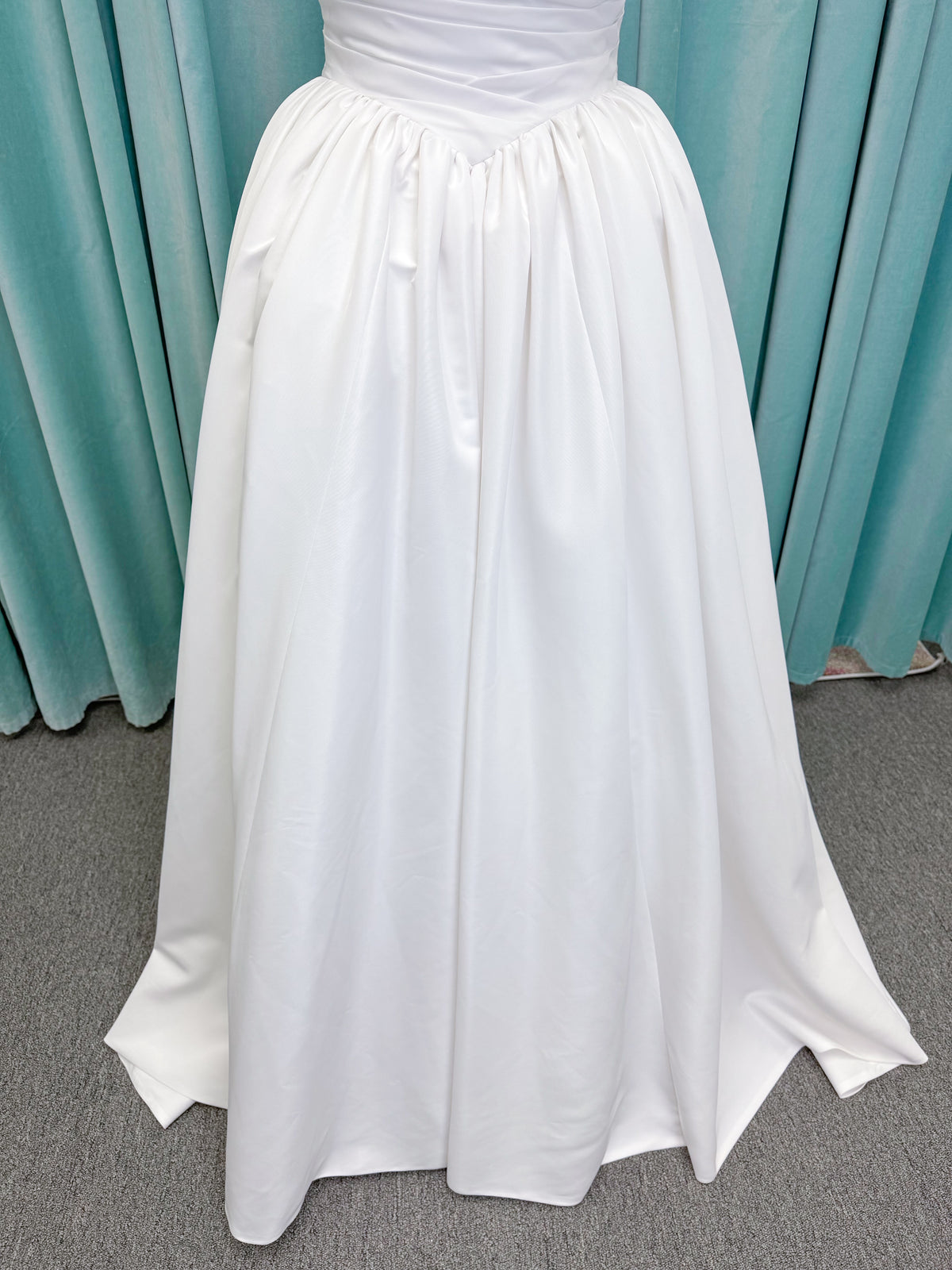 Morilee 1010003 Eleve A-line wedding dress on mannequin with scoop neckline, Chantilly lace peek-a-boo detail, beaded straps, and lace-up corset back